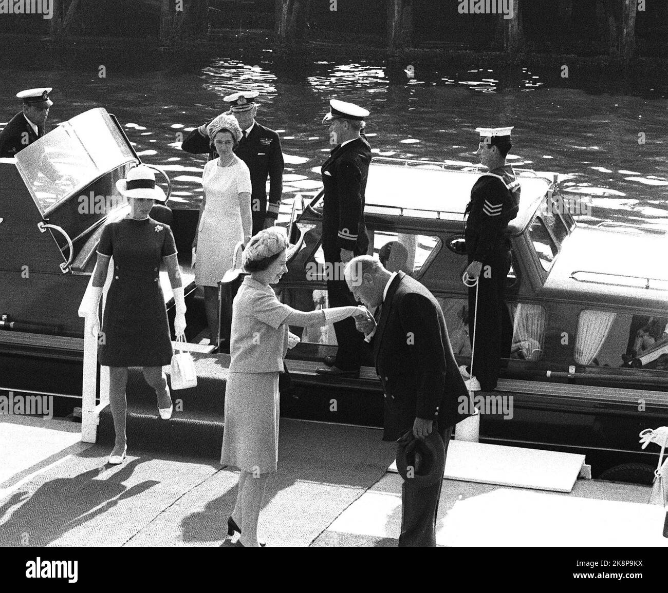 Molde 19690809. Queen Elizabeth II of England visiting Norway with her family. King Olav welcomes the royals to Molde and kisses the queen on hand. Ntb archive / ntb Stock Photo
