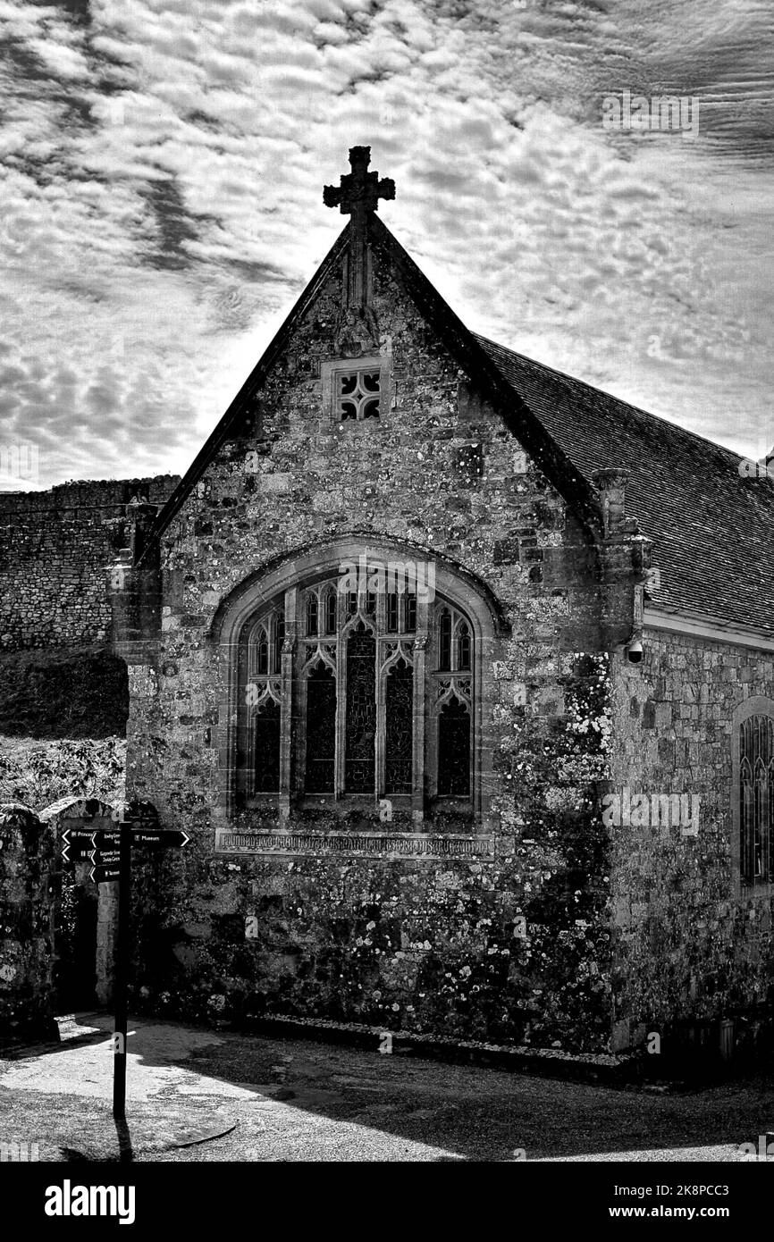 A vertical grayscale of a building in the ancient artillery fortress Carisbrooke Castle, Isle of