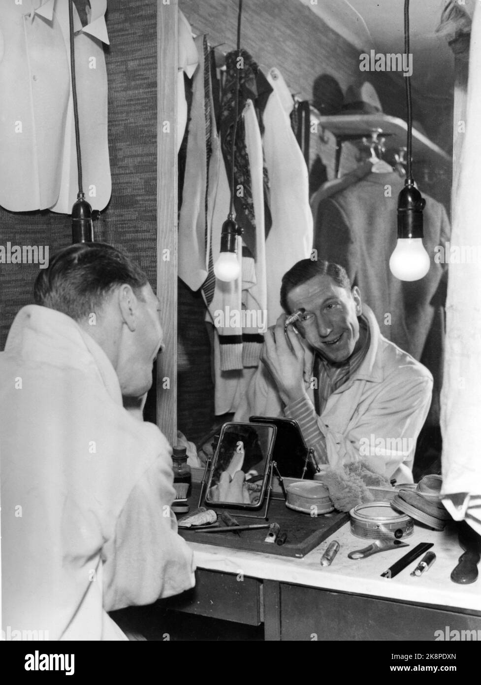 Oslo October 1942 Theater manager and actor Leif adjust makeup in the