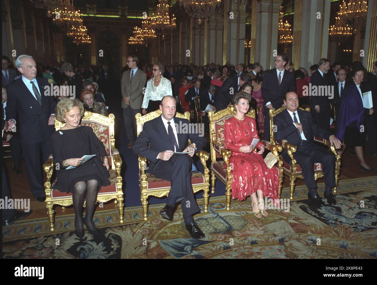 Paris France 19881116. The Crown Prince couple on an official visit to France. Crown Princess Sonja and Crown Prince Harald with Mrs. Bernadette Chirac (t.v.) and President Jacques Chirac (t.h.) during a concert in City Haal. Sonja in red dress. Photo: Morten Hval / Bjørn-Owe Holmberg NTB / NTB Stock Photo