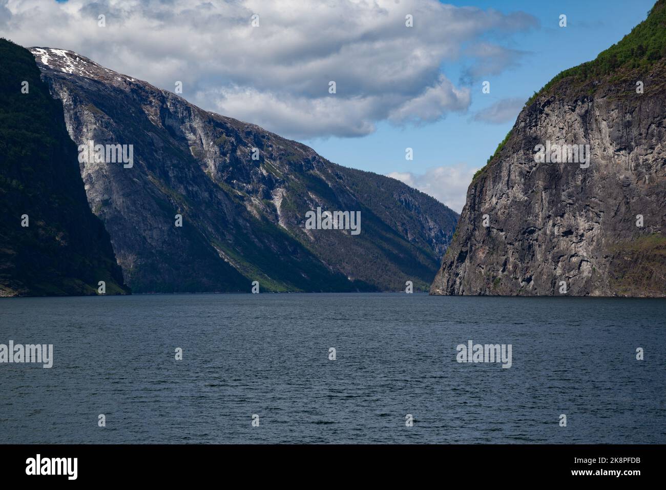 A lake under mountains in Narrow Fjord, Aurland Municipality in Vestland county, Norway Stock Photo