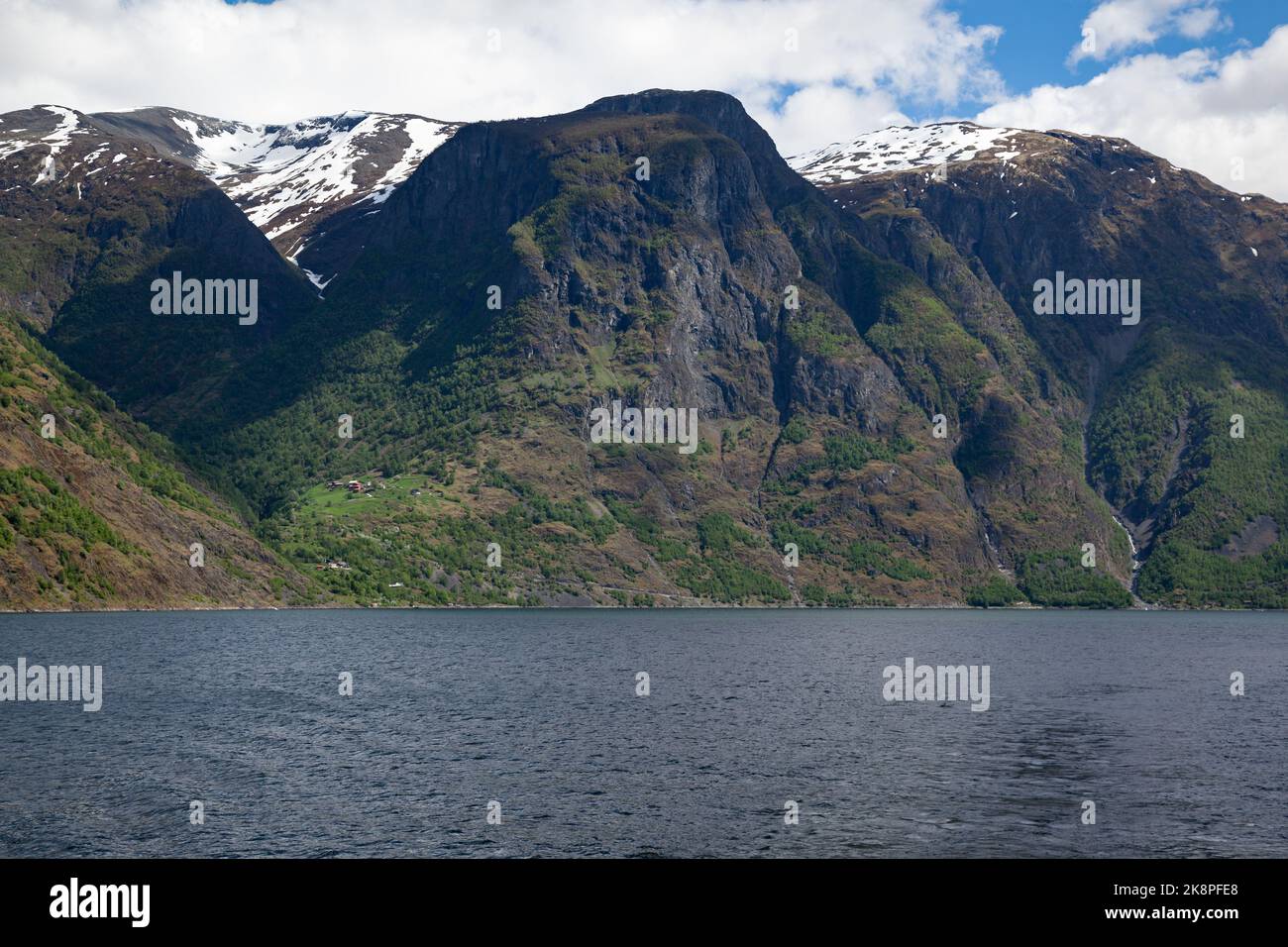 A lake under mountains in Narrow Fjord, Aurland Municipality in Vestland county, Norway Stock Photo