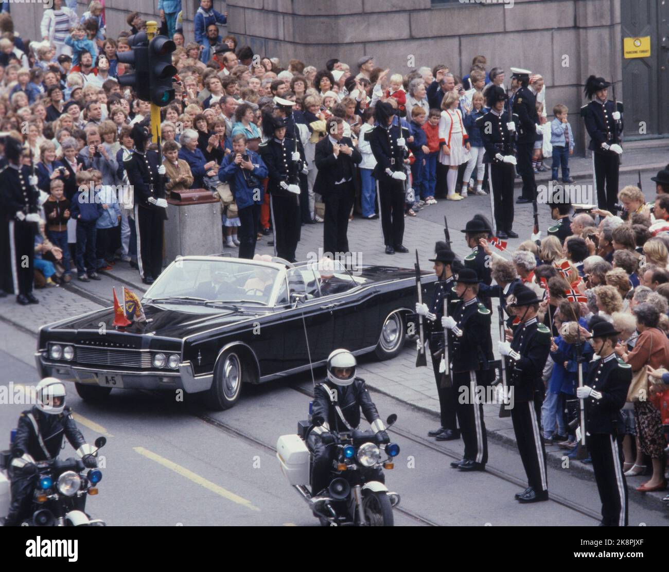Oslo July 2, 1983. King Olav is 80 years old. Here from car card up Karl Johansgate. King Olav sits in the car with queen mother Elizabeth. Photo: NTB / NTB Stock Photo