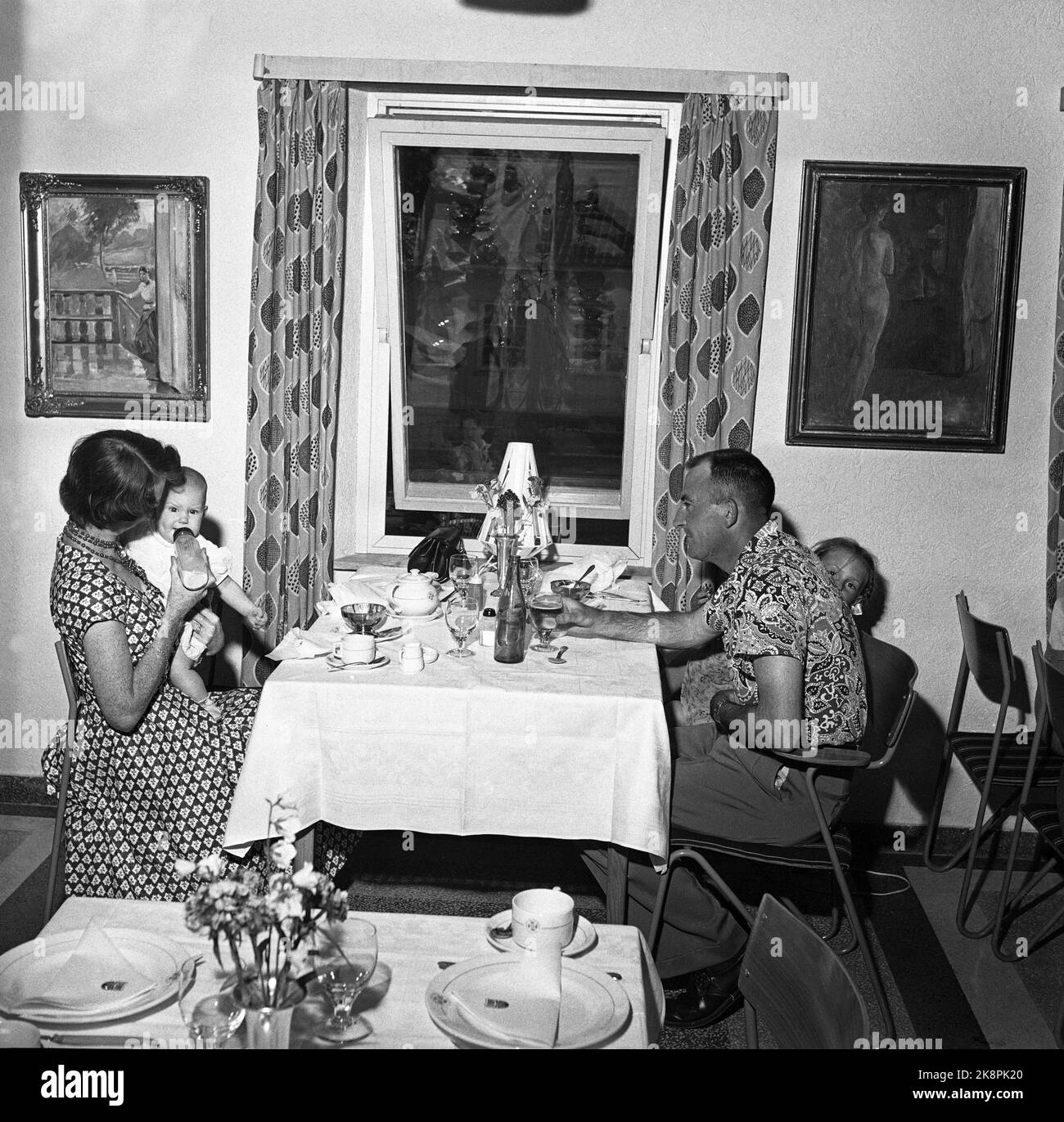 Oslo 1955. Northern Europe's largest hotel. Students' summer hotel at Sogn Studentby. From the restaurant, people sit and eat. Edvard Munch paintings hang on the back wall. Photo: Aage Storløkken / Current / NTB Premium Stock Photo