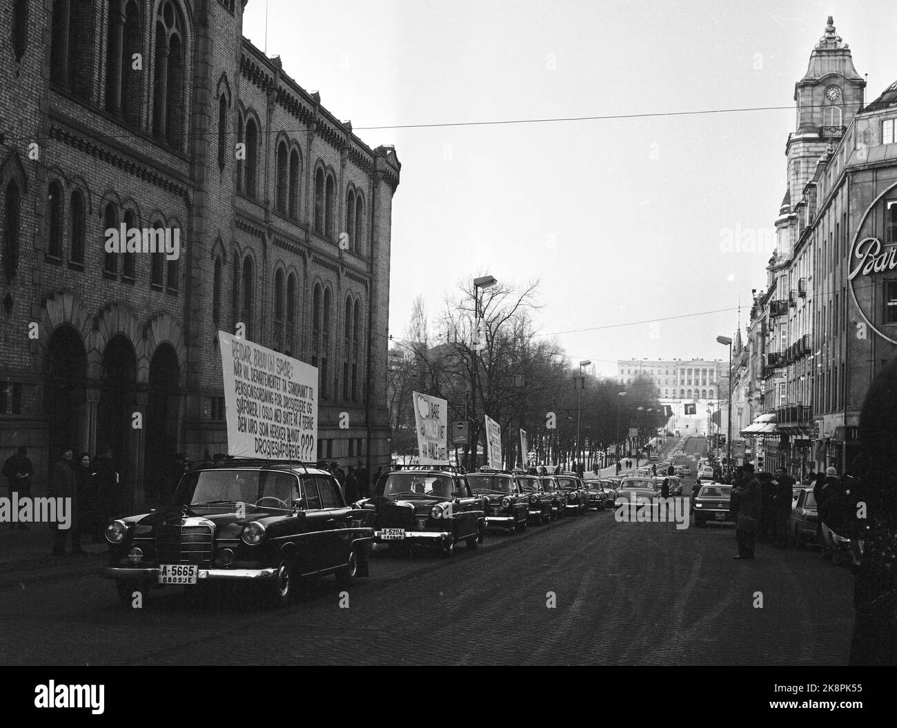Oslo 19650110 Taxi drivers strike and demonstrate against poor working conditions and work agreements, including Lack of pension scheme. Paign with posters on the taxi cars up Karl Johans gate. Photo: NTB / NTB Stock Photo