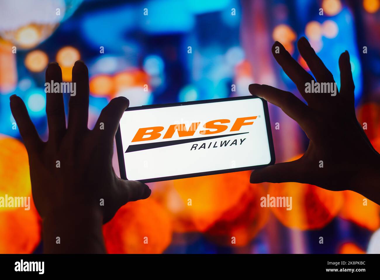 In this photo illustration, the BNSF Railway logo is displayed on a