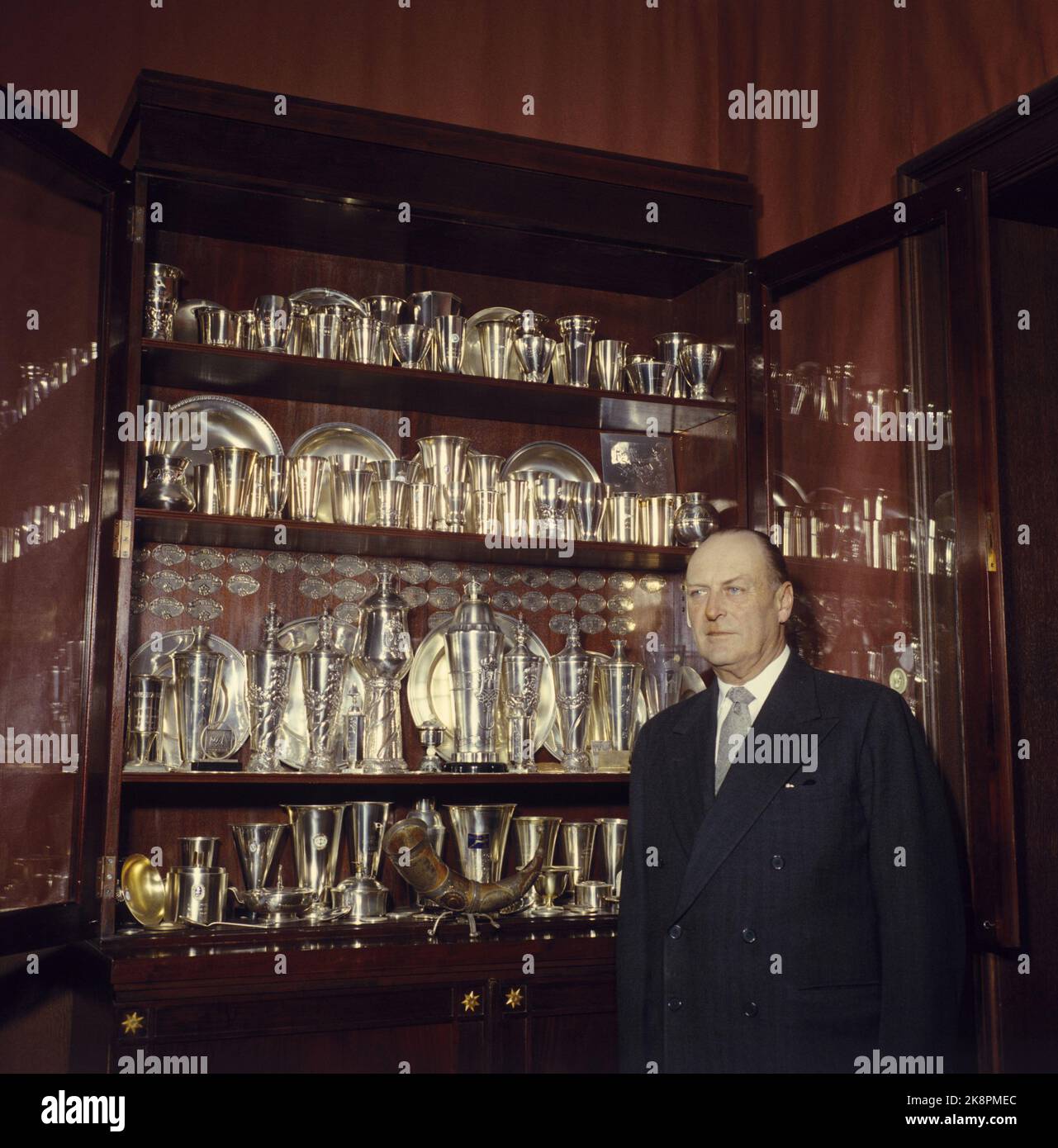 Oslo 197311 King Olav in front of cabinets with trophies at the castle ...