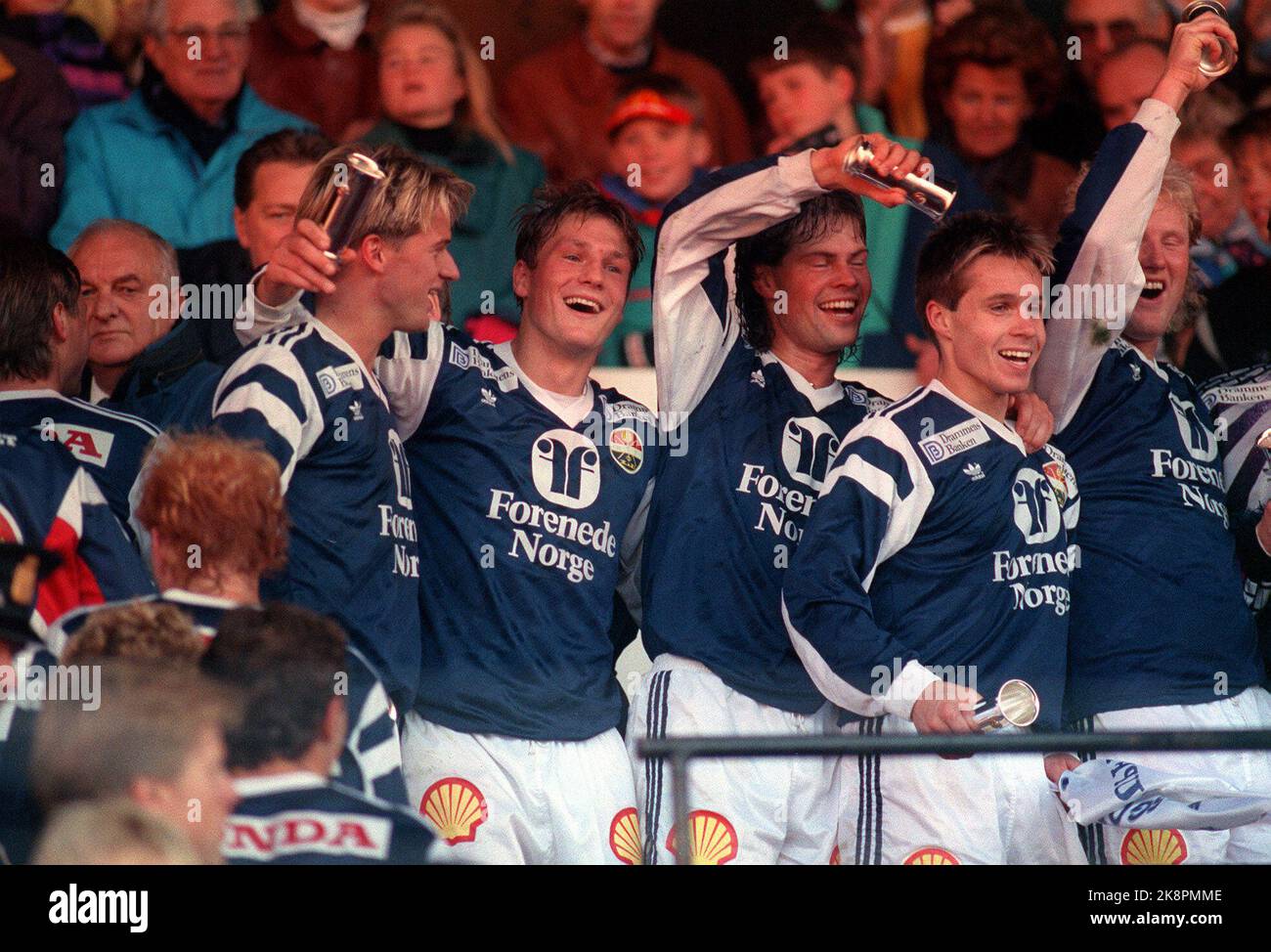 Oslo 19911020: Cup final 1991 -strømsgodset cheers after victory in the cup final against Rosenborg (3-2). Here happy Godset players with trophies. Photo: Bjørn Sigurdsøn / NTB Stock Photo