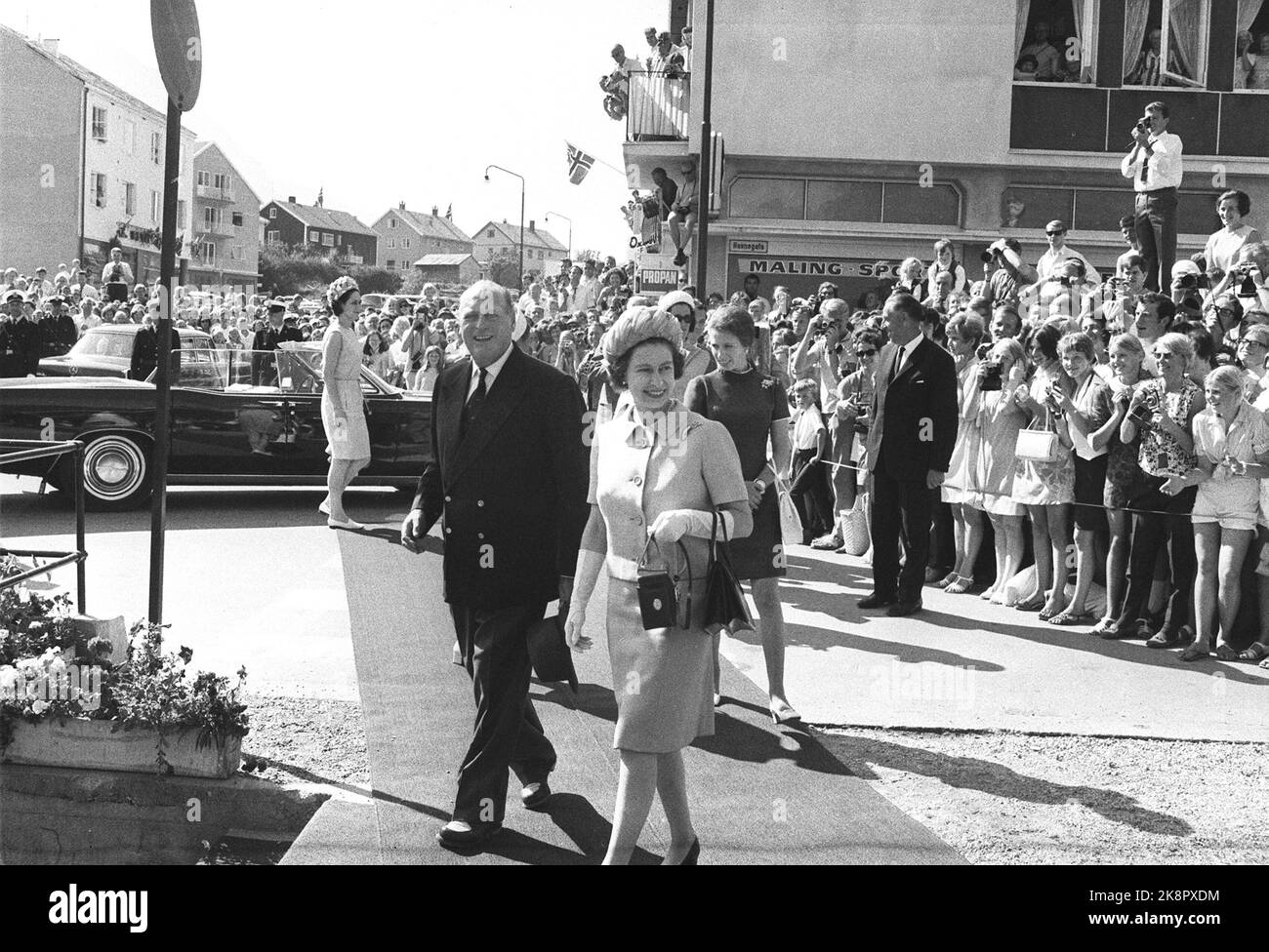 Åndalsnes 19690809. Queen Elizabeth II visiting Norway with the family. The Queen received a warm welcome from many children with Norwegian flags along the streets where Queen Elizabeth and King Olav walked. Smiling. Ntb archive / ntb Stock Photo