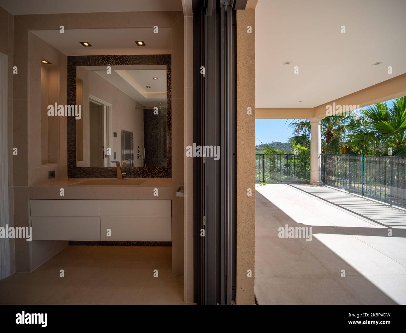A modern villa interior with a bathroom on the left balcony on the ...