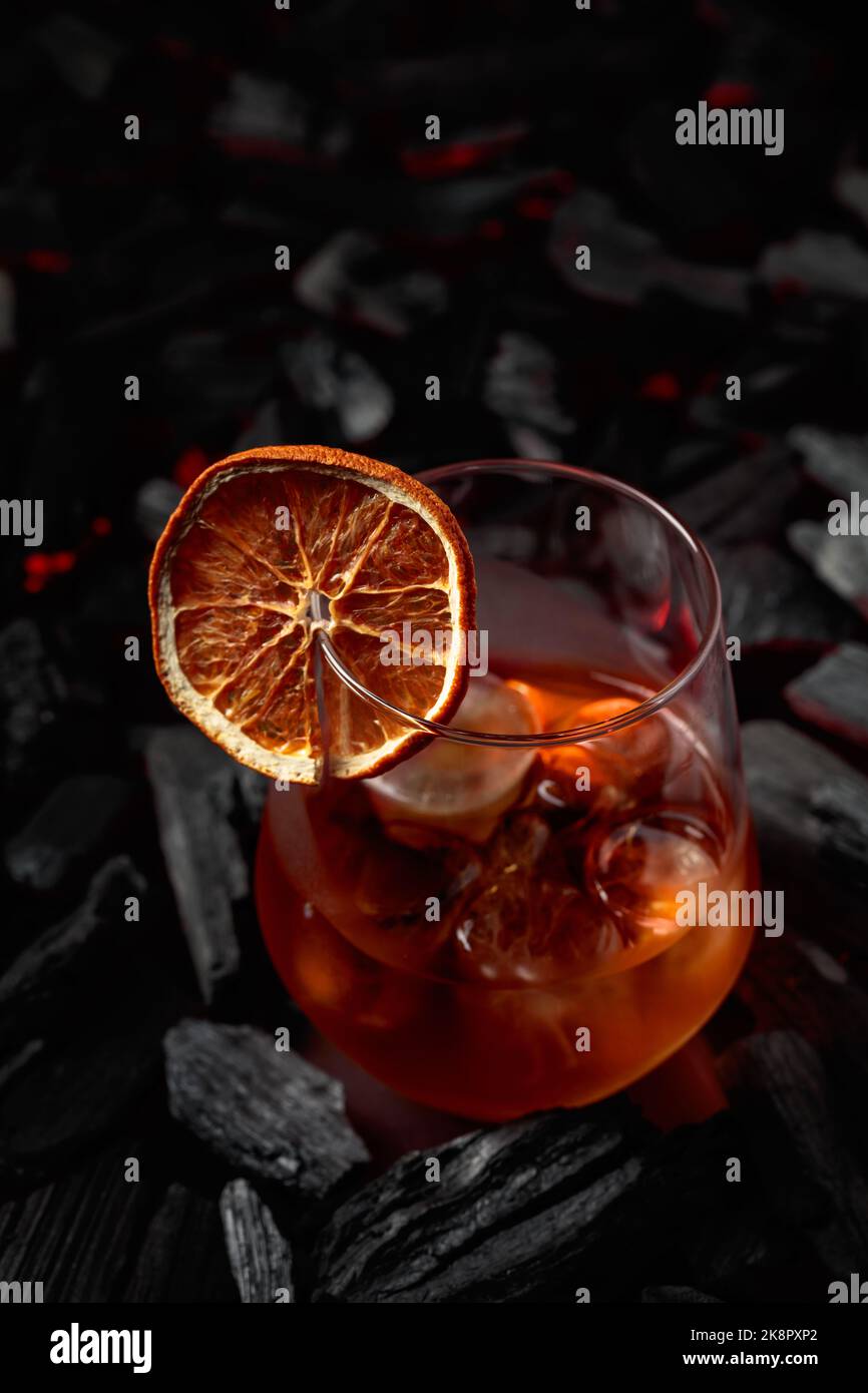 Oldfashioned cocktail with ice and dried orange slice Stock Photo Alamy