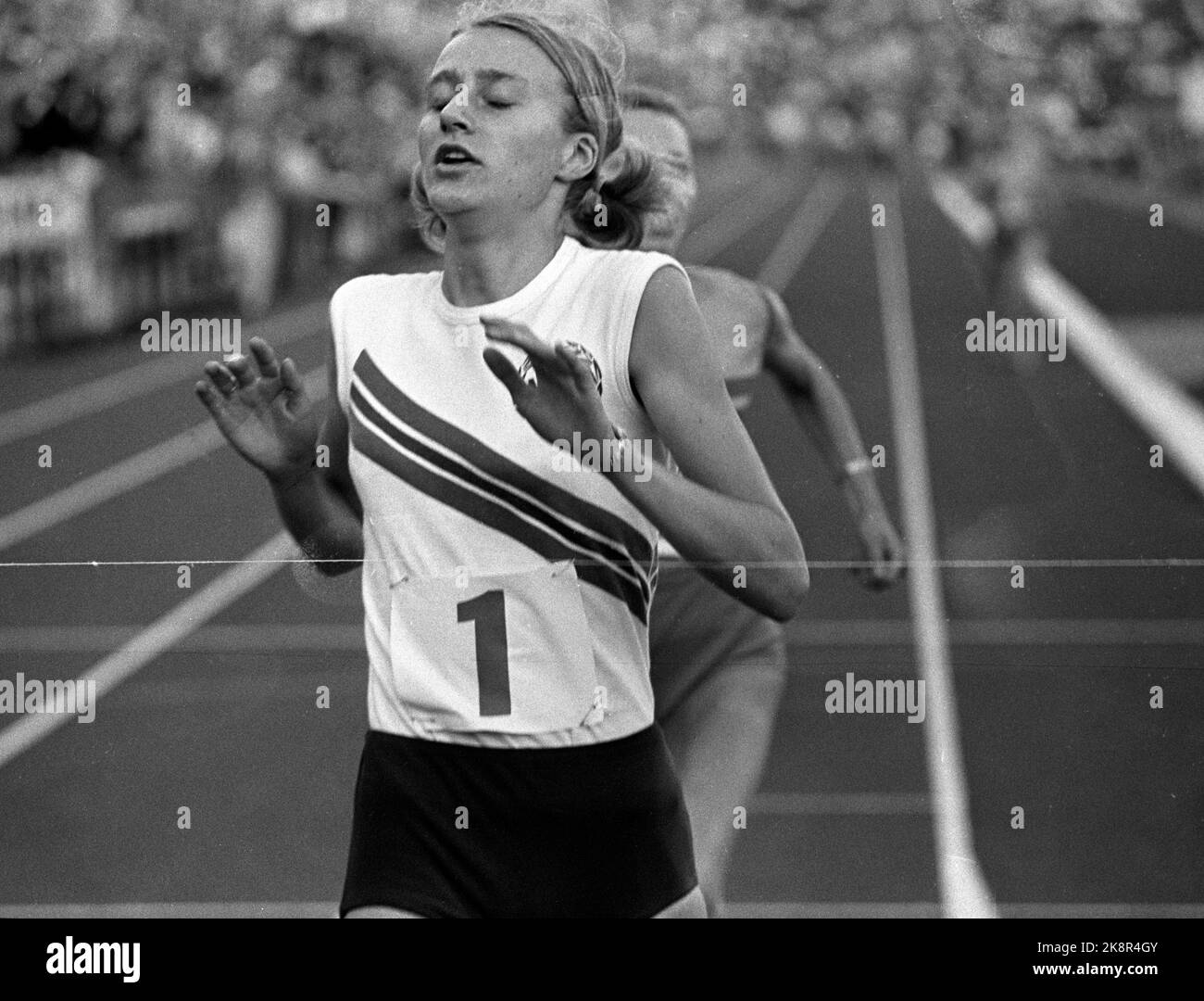 Oslo 19710630 Grete Waitz (Andersen) crosses the finish line as the winner of 1500 meters during the Landskampen at Bislett. Photo; NTB / NTB Stock Photo