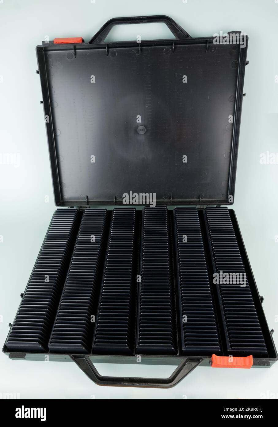 Black case with slide trays within Stock Photo