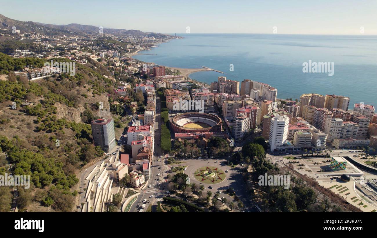 An aerial view of the bullring in Malaga, Spain surrounded by tall ...