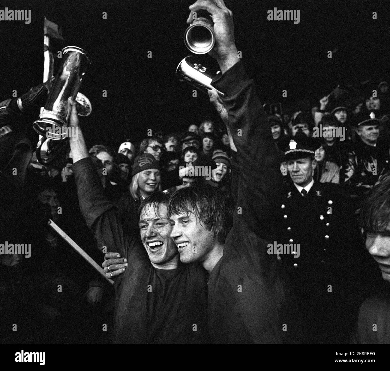 Oslo 19741020. Soccer. Cup final Skeid - Viking 3-1, Ullevaal Stadium. Skeid became Norwegian champions in the rain and sleet. Here, Skeid's team captain Tor Egil Johansen (t.v.) and Jan Birkelund cheers with the King's Cup. Photo NTB / NTB Stock Photo