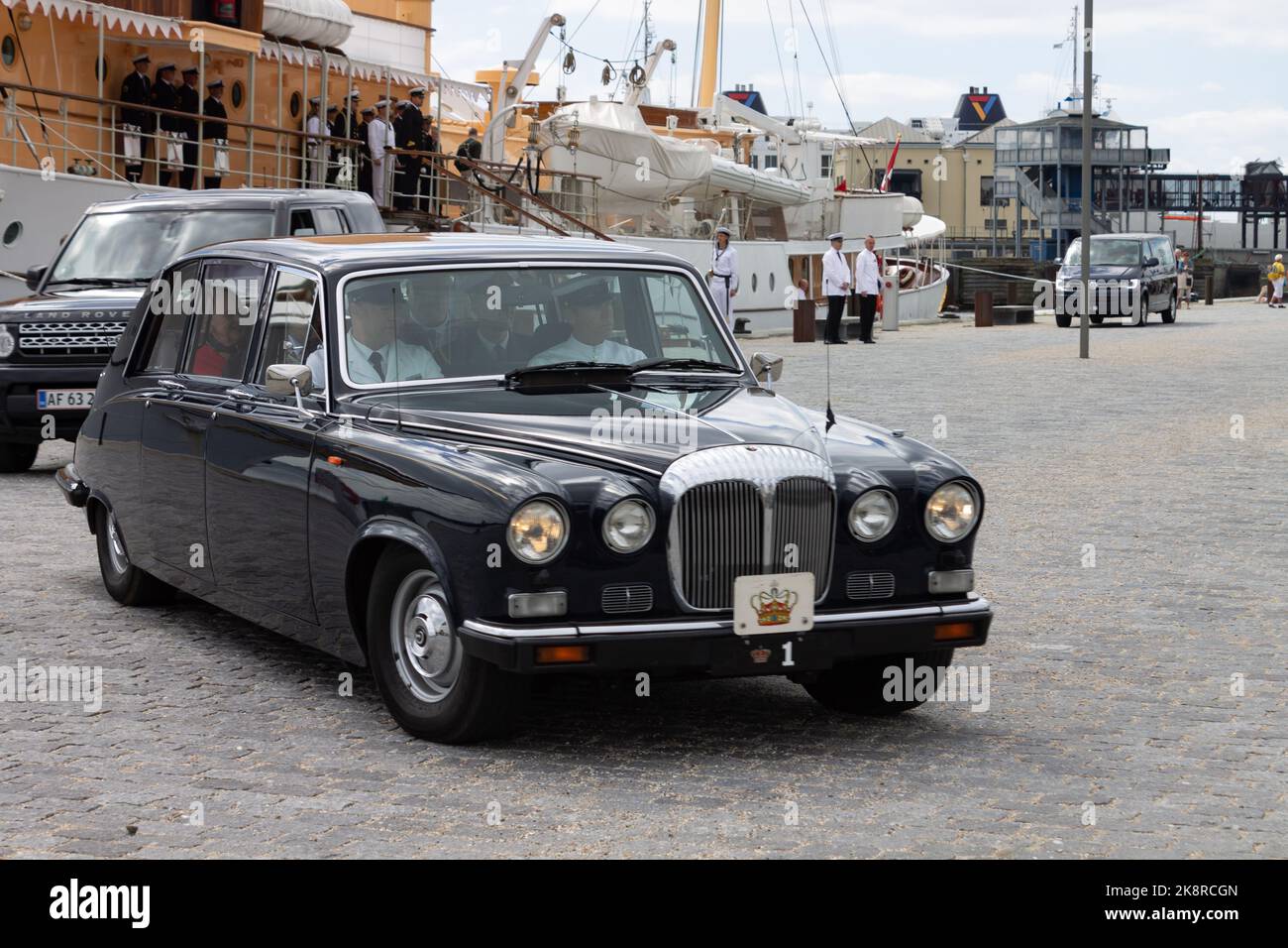 a black Rolls Royce near Navy ship with danish royal family member at the docks of Helsingor, Denmark Stock Photo