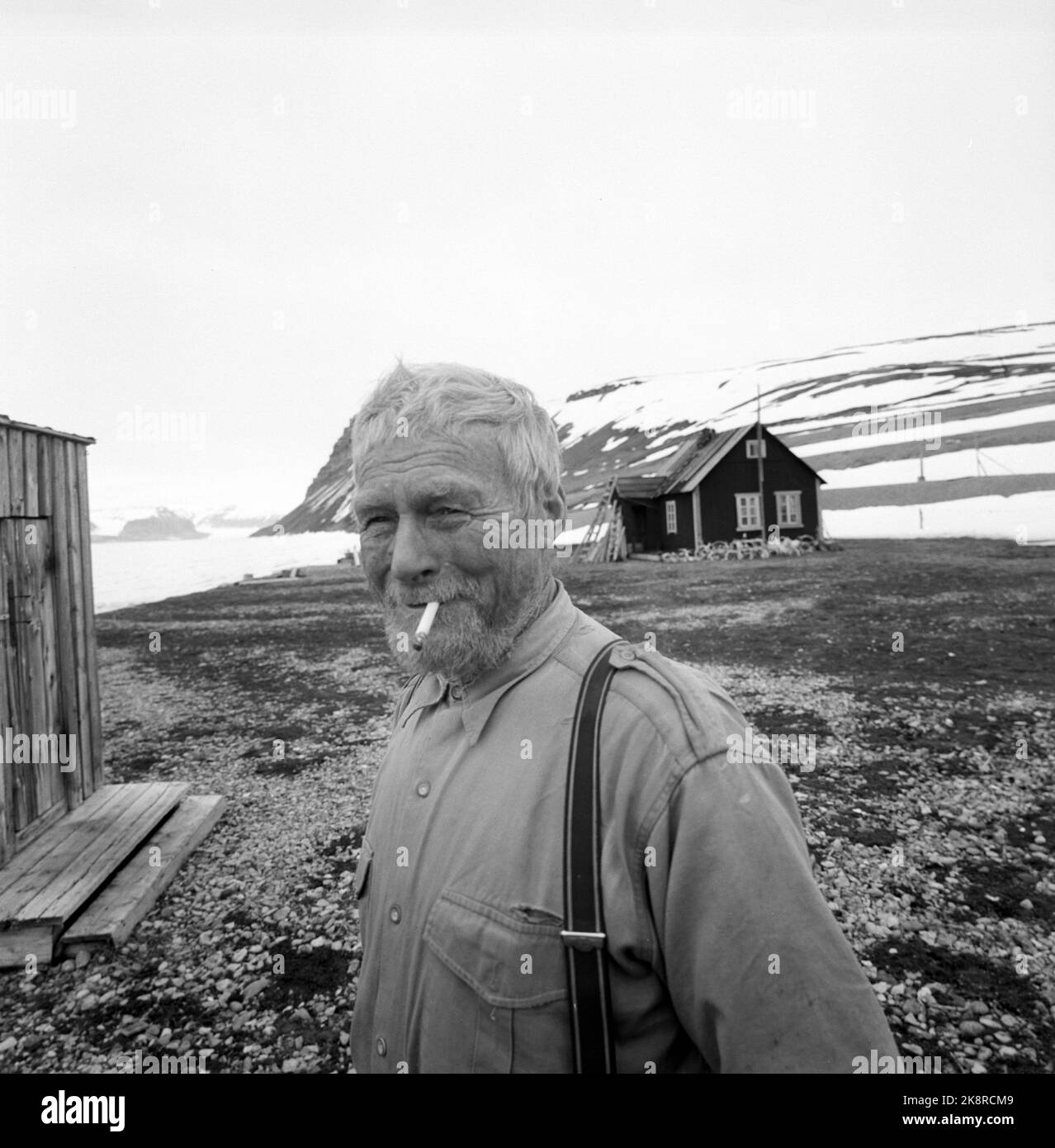 Svalbard, Sassen, 1963. Hilmar Nøis (72) is an adventurer, trapper and hunter. He has been wintering at Svalbard for many years, since he came here for the first time in 1909. Lately he has had his wife Helfrid with him, they were devoted by the Governor in 1937. Here outside the cabin Photo: Aage Storløkken / Current / NTB Stock Photo