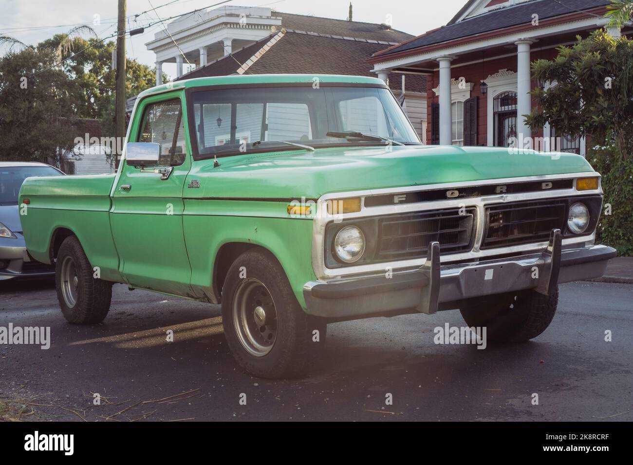 Landscape photo of a green vintage ford truck shot in New Orleans