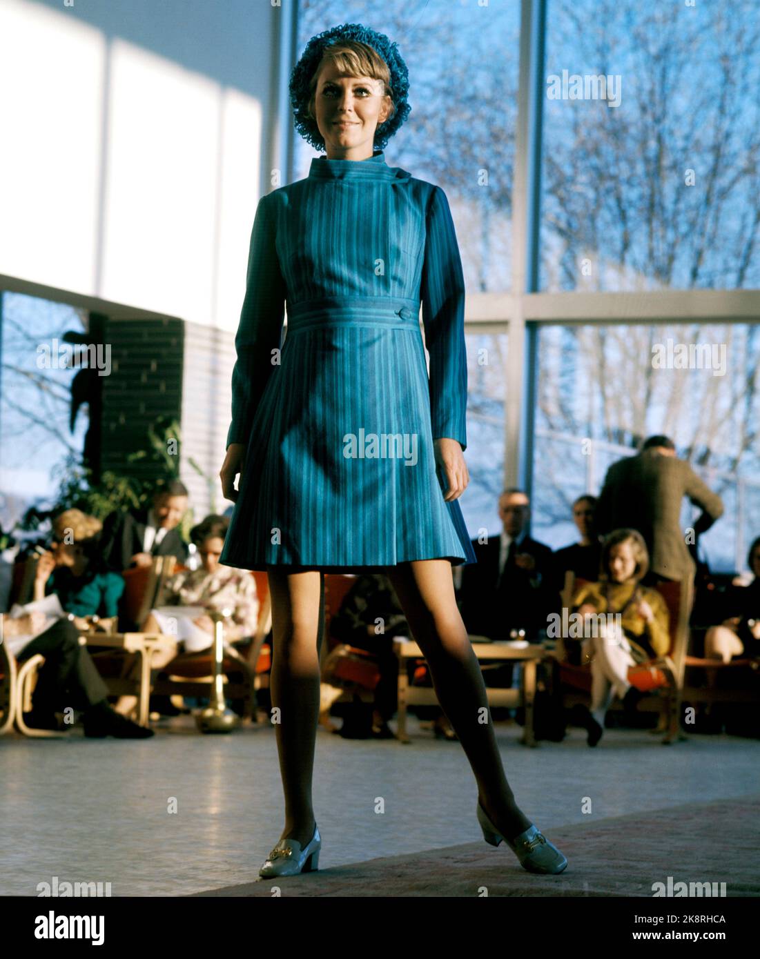 Oslo 19690323. Fashion from Solberg Spinneri from the 'Cotton Parad' shown to the public. Woman in short blue striped coat with knitting hat. Photo: Svein Hammerstad NTB / NTB Stock Photo