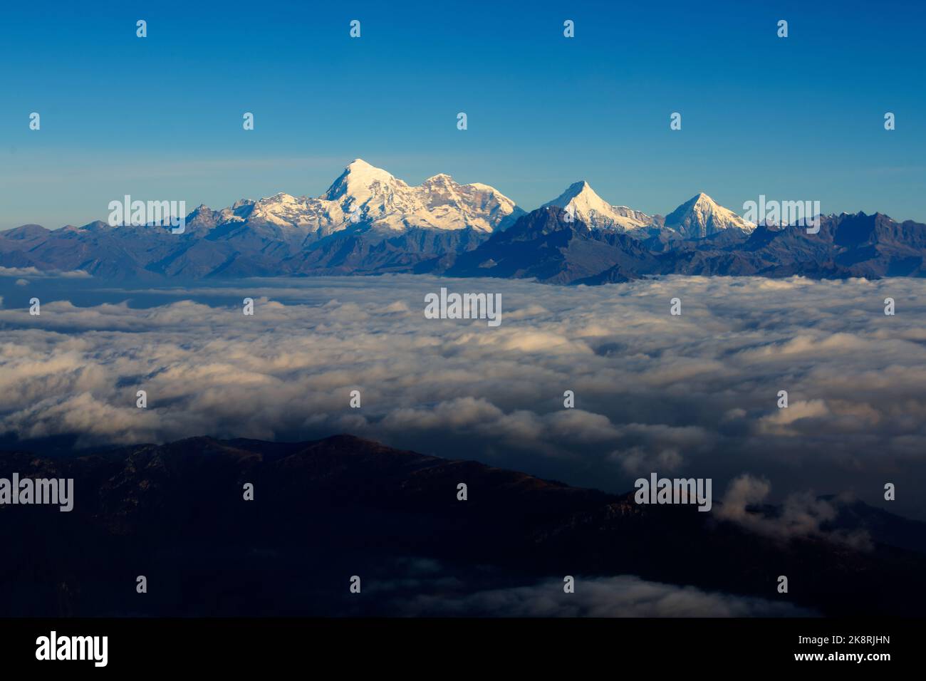 A scenic view of the peak of a mountain covered by snow Stock Photo - Alamy