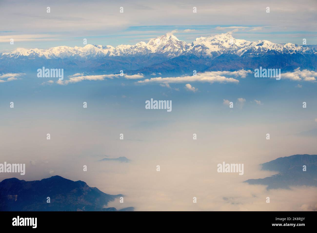 A scenic view of the peak of a mountain covered by snow Stock Photo - Alamy
