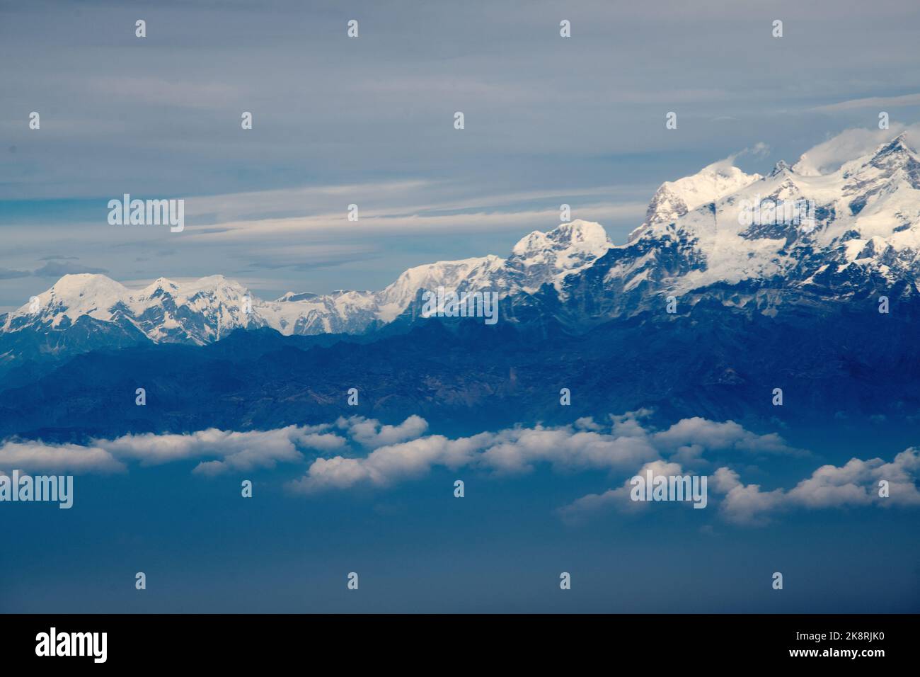 A scenic view of the peak of a mountain covered by snow Stock Photo - Alamy