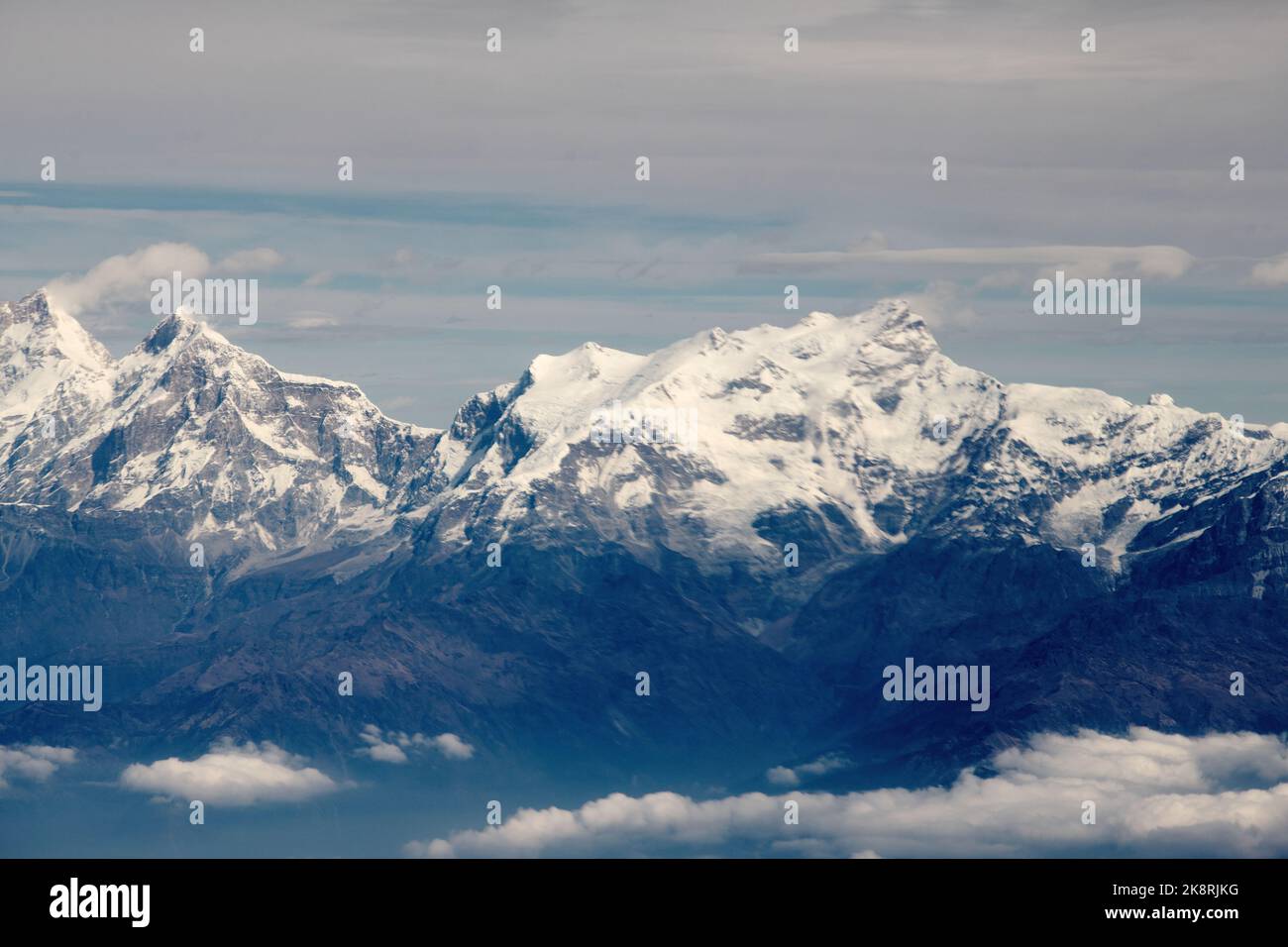 A scenic view of the peak of a mountain covered by snow Stock Photo - Alamy