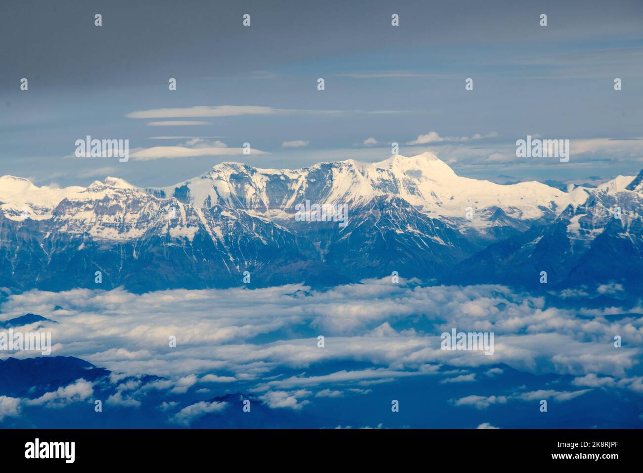 A aerial view of the peak of a mountain covered by snow Stock Photo - Alamy