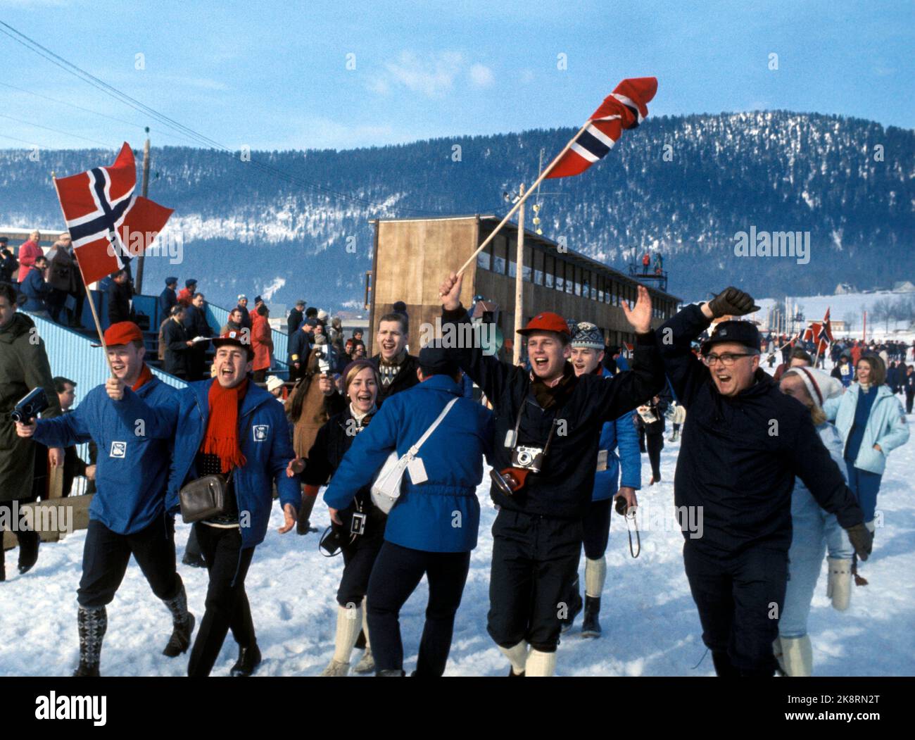 Grenoble, France 196802 Olympic winter games in Grenoble. Cross -country skiing, 4 x 10 km. relay men. It will be gold to Norway! Norwegian spectators run, rejoice and fans with Norwegian flags. Photo: NTB / NTB Stock Photo