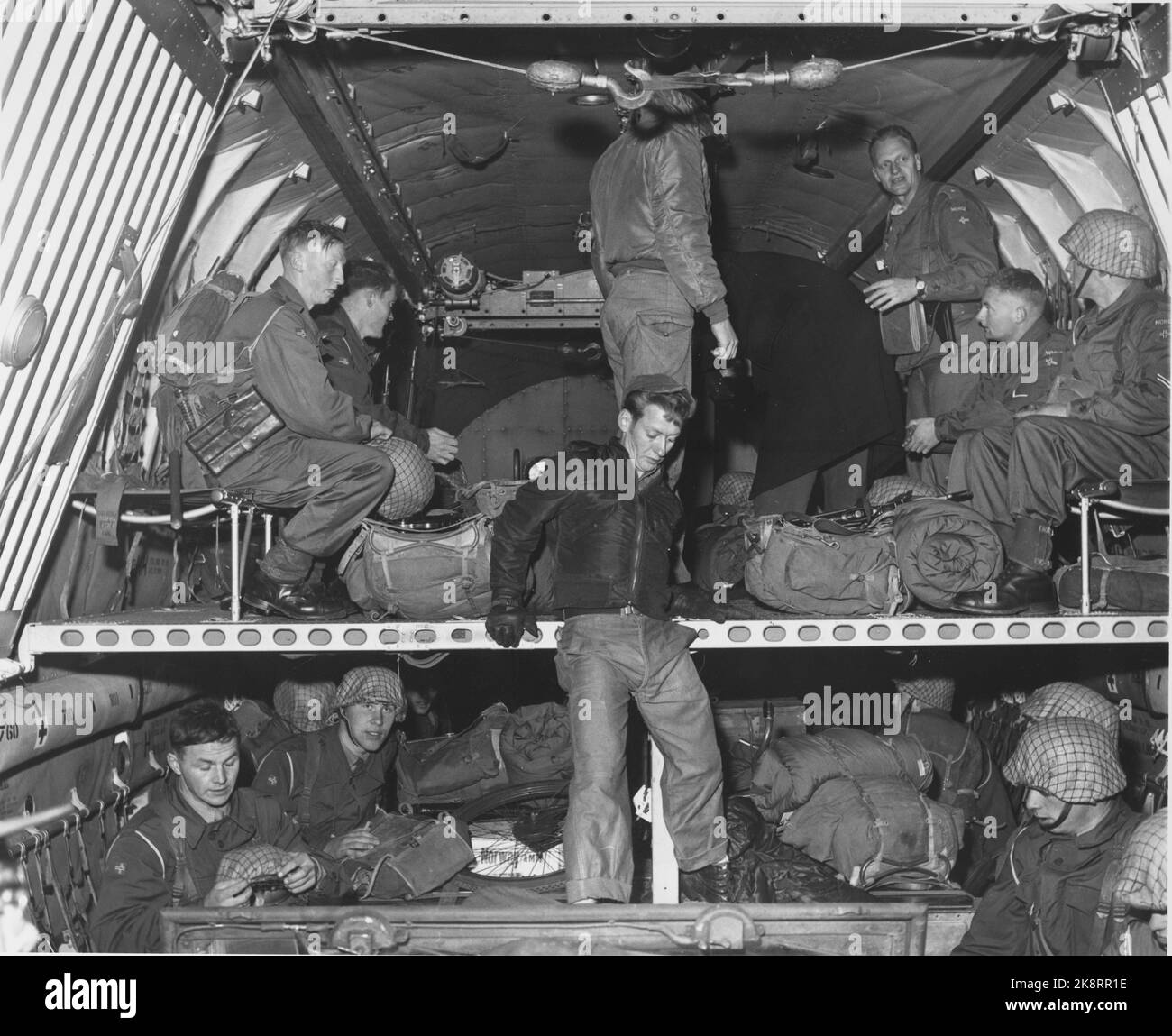 Naples, Italy November 1956. Norwegian police troops on their way to Suez to participate in the international police force. 5000 UN soldiers from the Nordic countries, Canada, India and Pakistan are gathered in Naples. The soldiers had to wait in Naples until there was agreement between the UN and Nasser on the conditions of the international guard forces' stay in Egypt. Here soldiers aboard the American Globemaster troop transport aircraft that take 200 soldiers. Photo: Sverre A. Børretzen Current / NTB Stock Photo