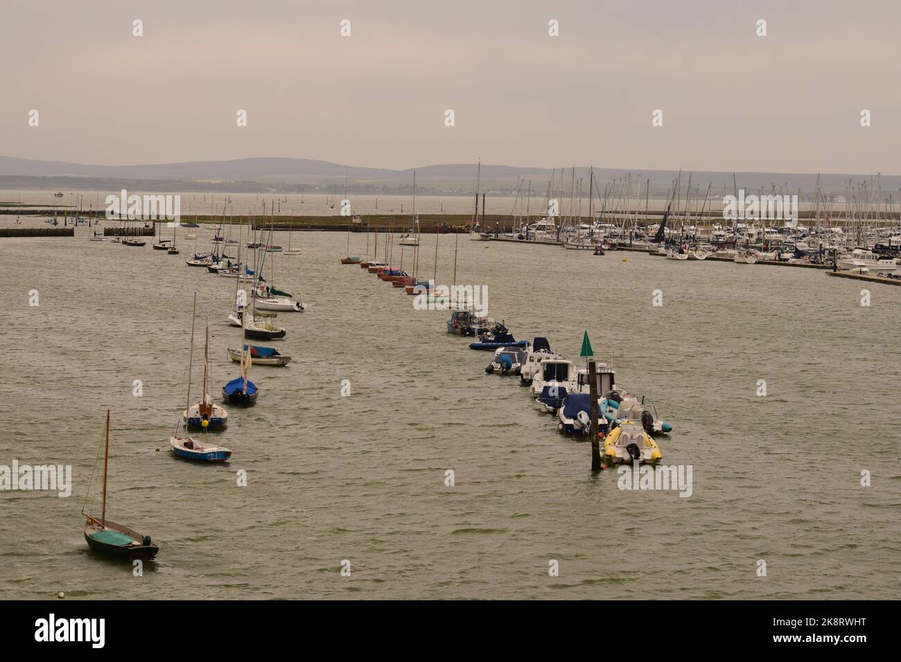 An aerial view of rows of anchored boats in the sea by the port Stock ...