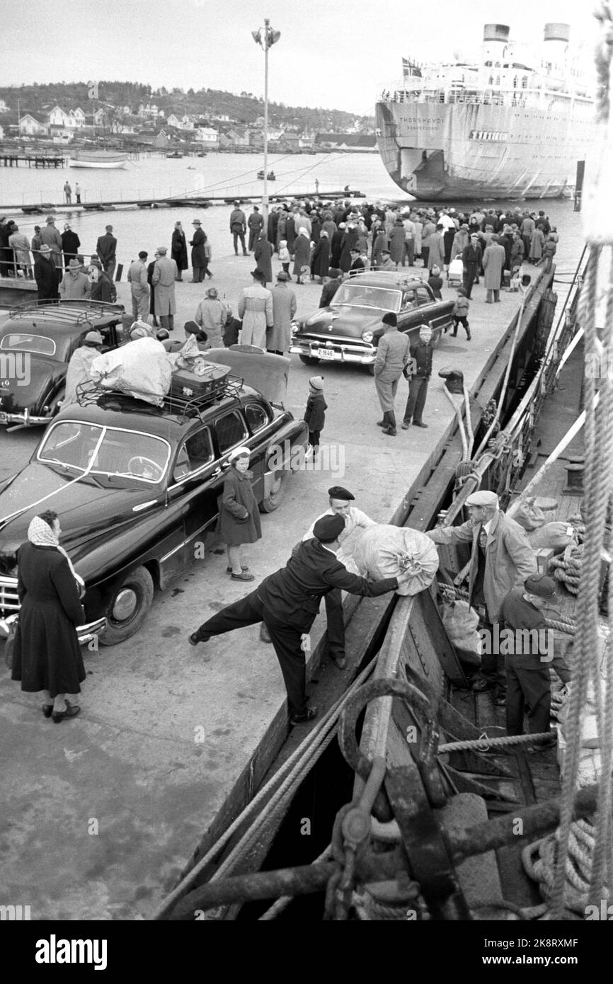 Family and friends stand on the pier and them hires stock