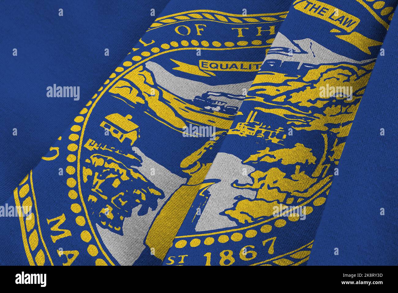 Nebraska US state flag with big folds waving close up under the studio