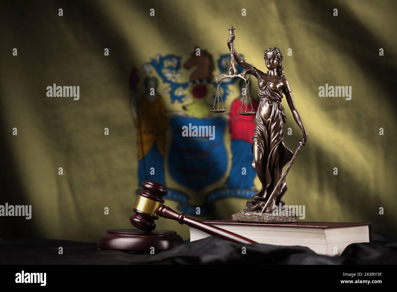 New Jersey US state flag with statue of lady justice, constitution and