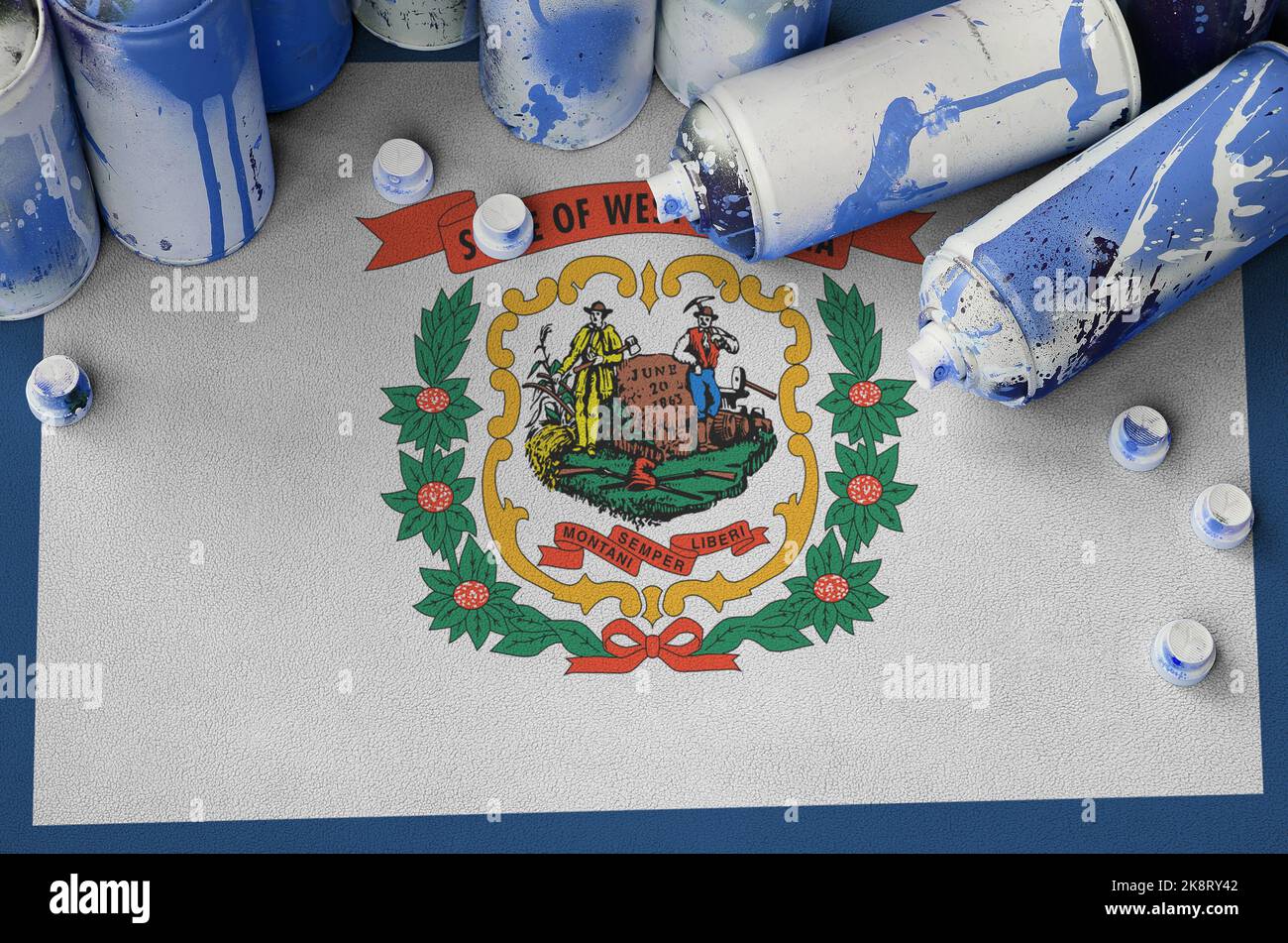West Virginia US state flag and few used aerosol spray cans for