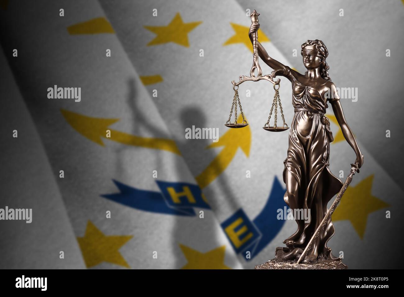 Rhode Island US state flag with statue of lady justice and judicial scales in dark room. Concept of judgement and punishment, background for jury topi Stock Photo