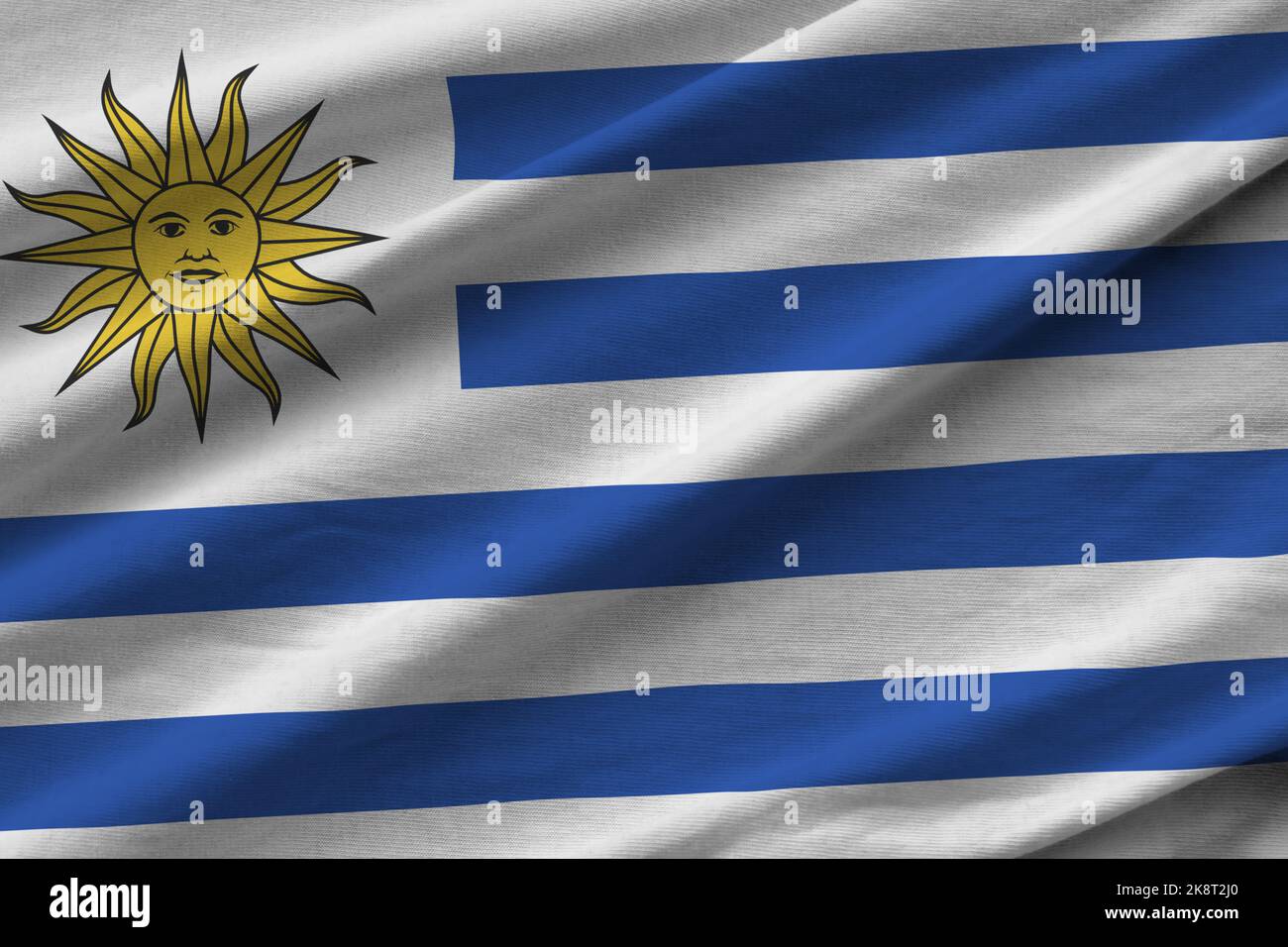 uruguay-flag-with-big-folds-waving-close-up-under-the-studio-light