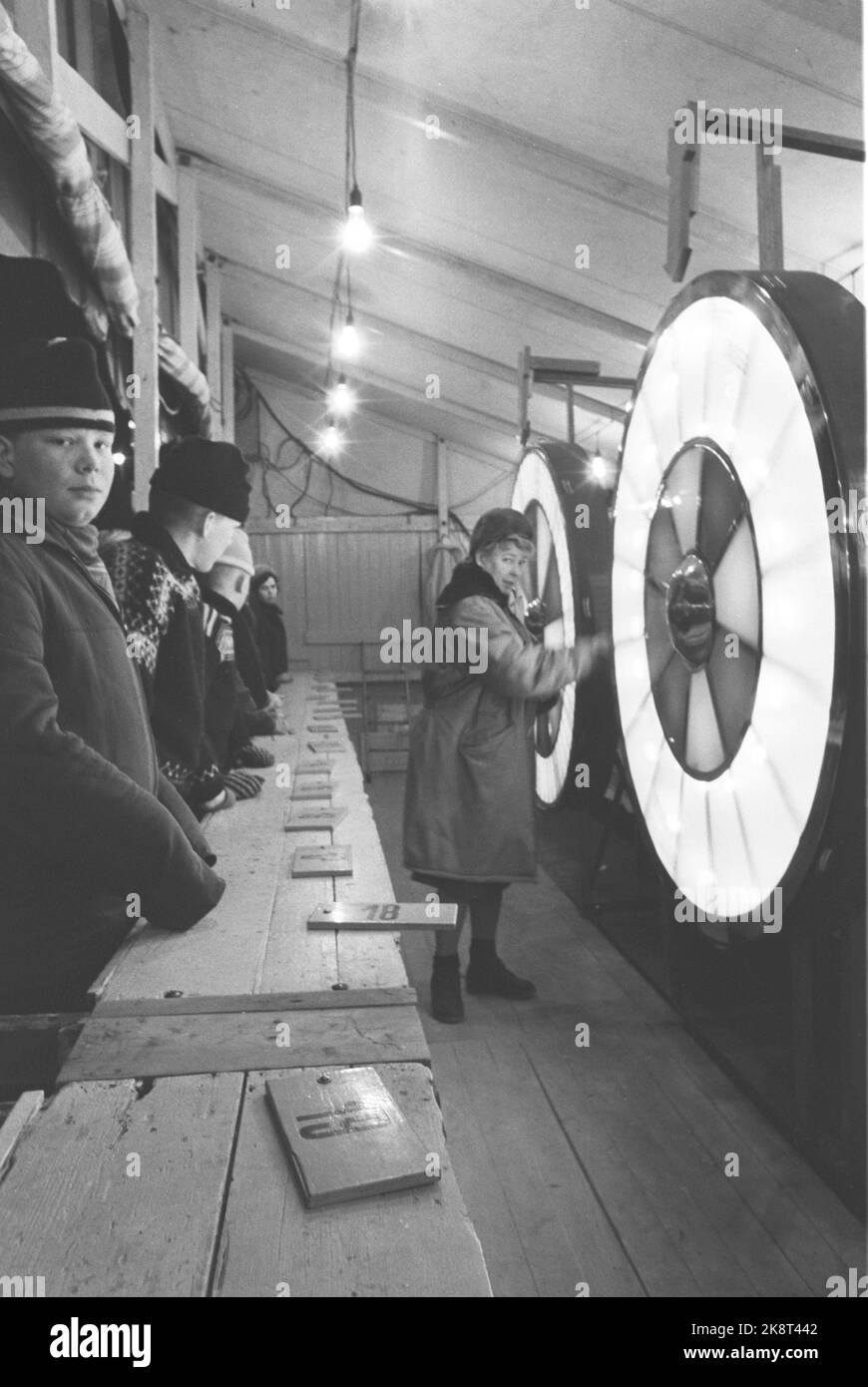 Oslo 19620331. Safe Spring Tivoli has come to town and Youngstorget. Here the lucky wheel is underway and many found their way to try the winning luck. Photo: Bob Robinson Current / NTB Stock Photo