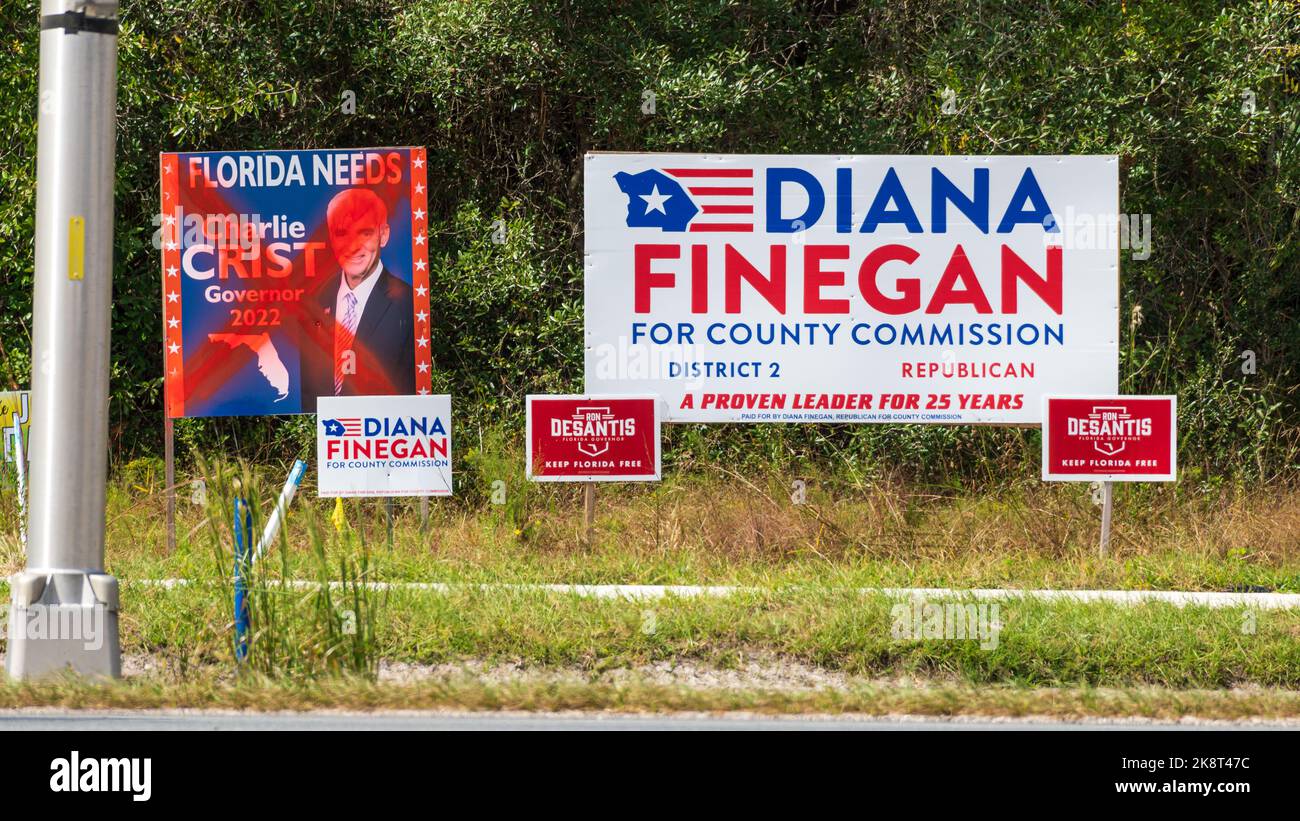 Charlie Crist Governor 2022 election sign with spray painted red 'X' on roadside in Citrus County - Homosassa, Florida, USA Stock Photo