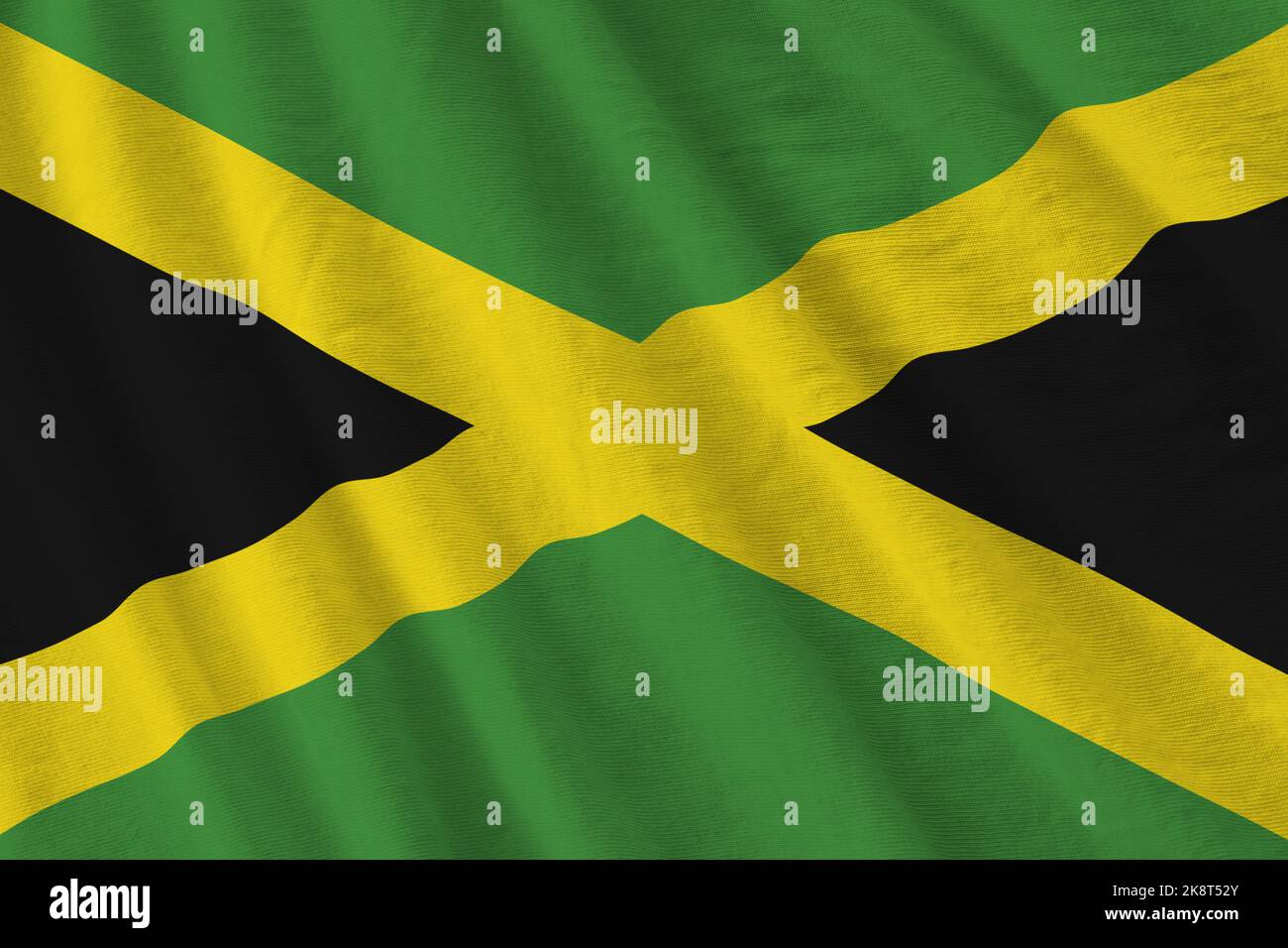 Jamaica flag with big folds waving close up under the studio light