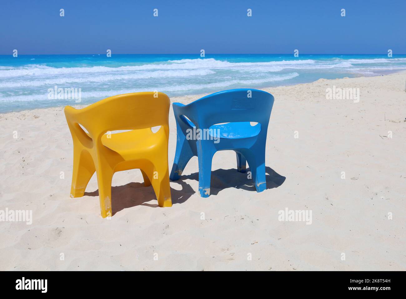 Blue and yellow chair at beautiful sea beach, vacation holiday weekend