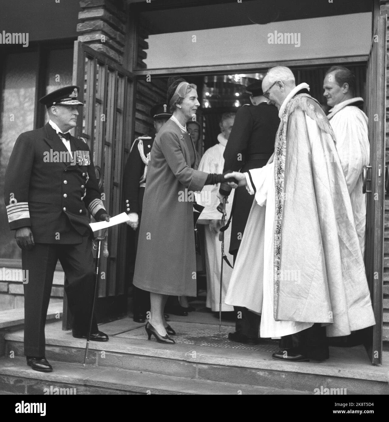 Copenhagen, Denmark 19581123. The new Norwegian Sailor Church King Haakon's church in Copenhagen was inaugurated with King Olav present. Outside the church, many Danes had arrived and the Norwegian king's guard played during the event. Here, Queen Ingrid greets Denmark at Bishop Johs. Smemo. King Olav (t.v.) in the picture. Photo: NTB Archive / NTB Stock Photo