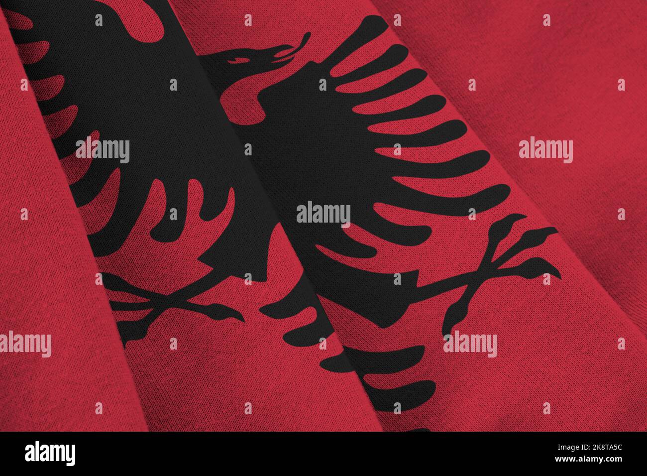 albania-flag-with-big-folds-waving-close-up-under-the-studio-light