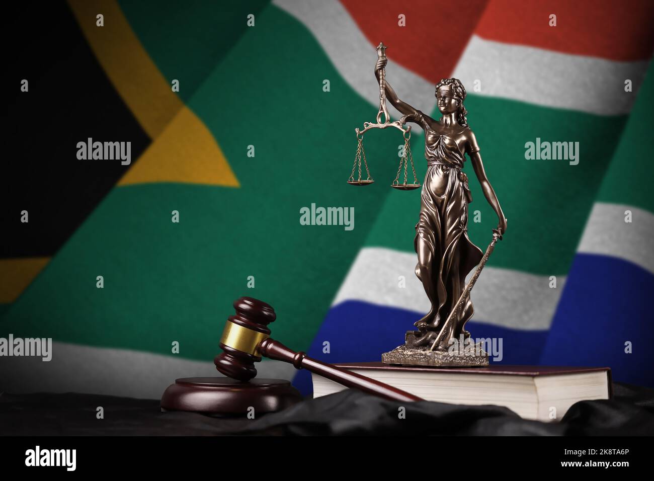 South Africa flag with statue of lady justice, constitution and judge ...