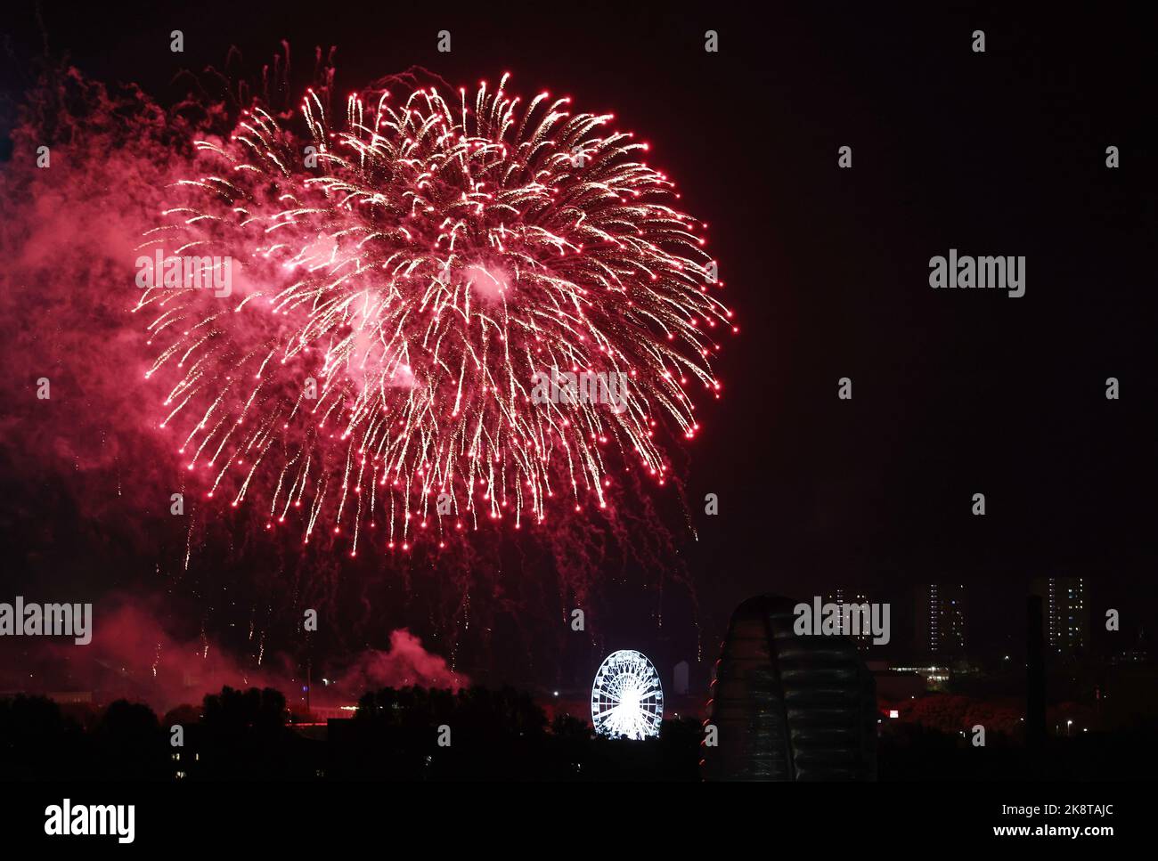 Leicester, Leicestershire, UK. 24th October 2022. Fireworks explode behind the Wheel of Light during Diwali celebrations on the Golden Mile. LeicesterÔs celebration of Diwali is one of the biggest outside of India. Credit Darren Staples/Alamy Live News. Stock Photo