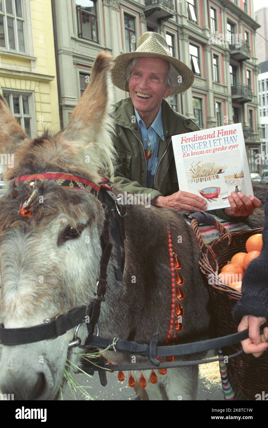 Oslo 19911015 - painter and author Ferdinand Finne presents his new book 'Ringer in a Sea'. Here along with a party -decorated donkey. Photo: Bjørn Sigurdsøn / NTB Stock Photo