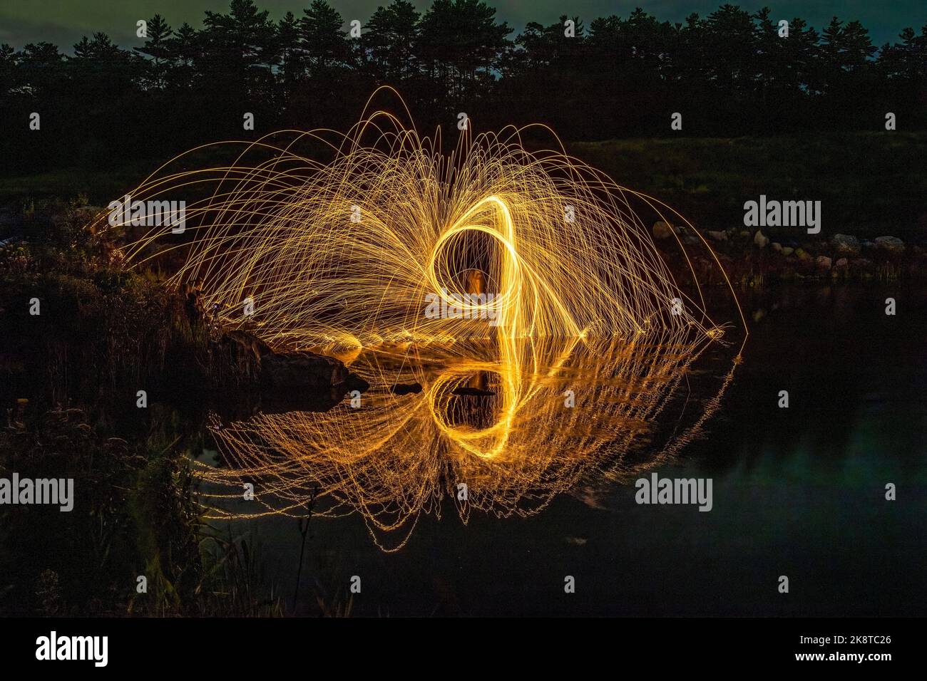 A steel wool painting and reflection on the lake Stock Photo Alamy
