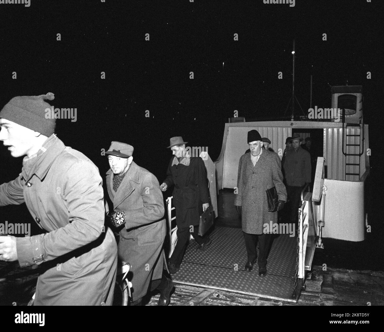 Oslo - Fredrikstad 1962. Long night's journey to work. 'While most of the population sleeps, the new' pariacast 'must out of the duvets. They have from two to four hours of travel to work every day.' Report on commuting from Fredrikstad. Here P. Mosgaard on the ferry over Glomma. Photo: Ivar Aaserud / Current / NTB Stock Photo