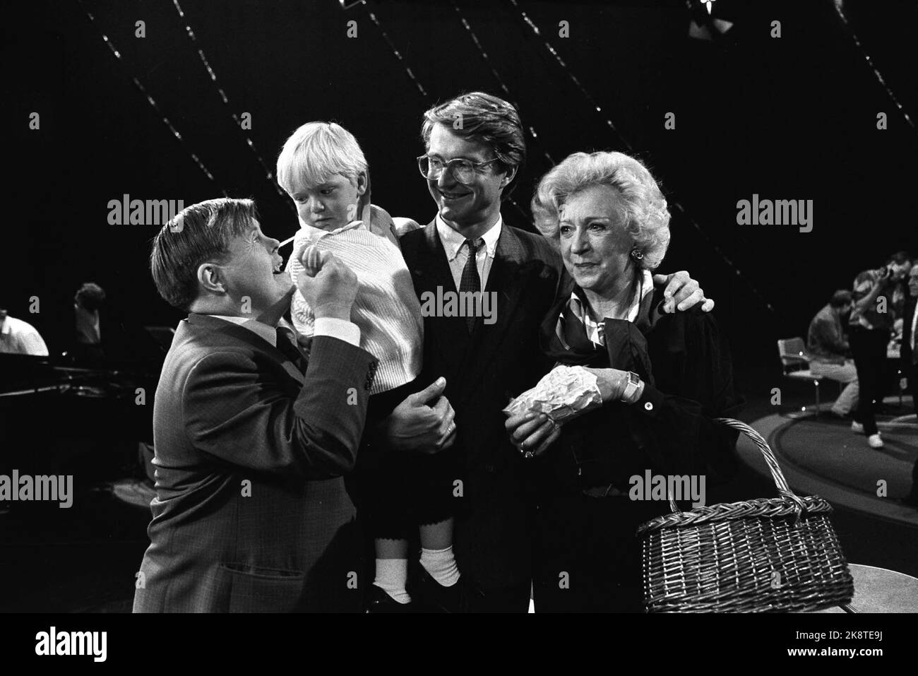 Oslo 19850929. Wenche Foss with his son Fabian Stang and his grandson Fabian Emil after the TV program 'This is your life'. Foss with basket on the arm. Photo: Henrik Laurvik / NTB Stock Photo