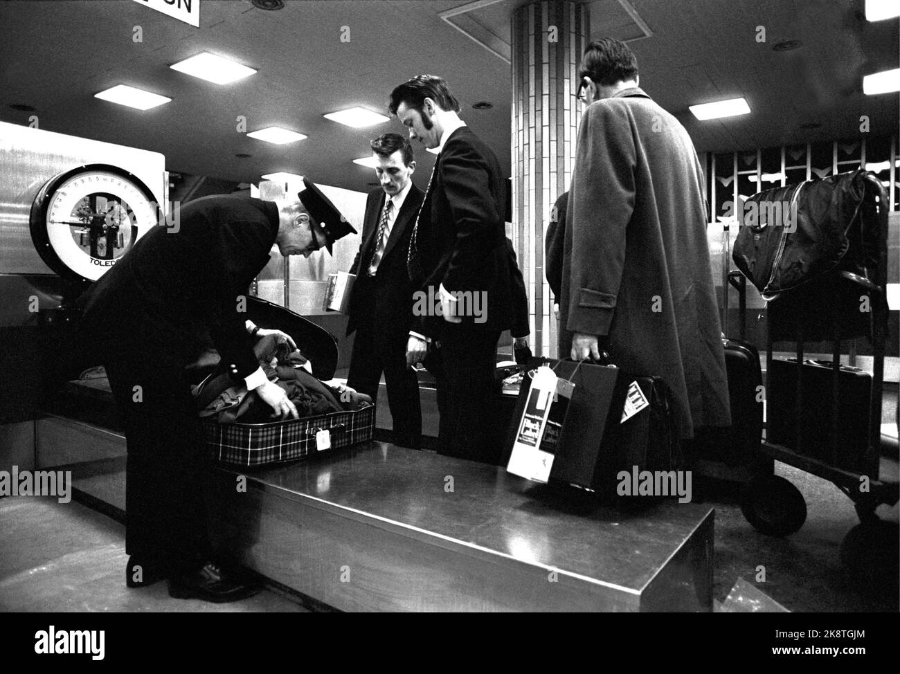Fornebu February 1970 From Oslo Airport Fornebu. What happens at an airport during the day? Passengers on the way through customs after arrival. Toller checks a suitcase. Photo: Per Ervik / Current / NTB Stock Photo